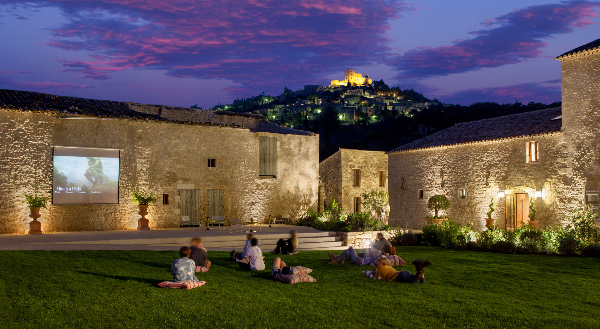Students watching movie outdoors